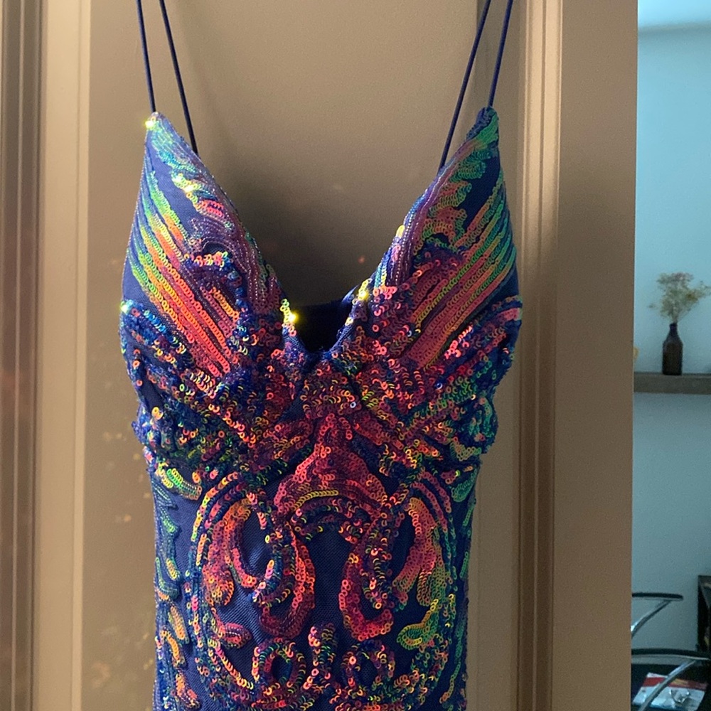 Multicolor sequin dress, fits body comfortably. Backless with X cross.
